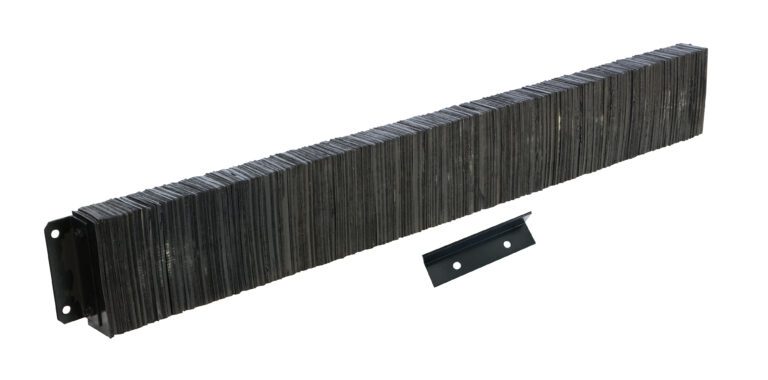 1296-4.5_A.jpg A stack of long, rectangular dark metal plates resembles the Vestil Laminated Dock Bumper 12 X 96 X 4.5 In. Beside it is a smaller black metal bracket with two holes, angled slightly to the right.
