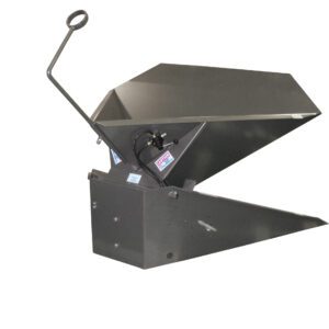 The Vestil Hand Lever Air Corner Tilter 1.5K Lb is a durable metal industrial tool with a dark-colored finish, featuring a large hinged bucket and lever arm ideal for loading or dumping materials, complemented by a sturdy base and angled edges.