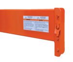 Close-up of a Vestil Pallet Racking Step Beam 6000 Lb 12 Ft, highlighting its English and Spanish warning label with safety instructions. It has a hook and mounting feature for secure attachment.