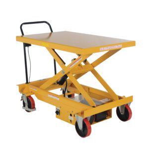 The Vestil Dc Power Hydr Scissor Cart 1K 31.5X47.25 has a yellow hydraulic lift table with a handle, four wheels (including two red ones), and features an X-shaped lift mechanism with a flat top, ideal for lifting heavy objects in industrial settings.
