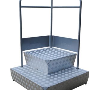The Vestil Container Step Platform, 31 x 31 inches, supports up to 485 lbs and features a checkered metal podium step with two levels. Surrounded by minimalist railing, it boasts a simple industrial design in a sleek silver finish.