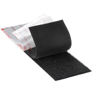 Close-up of a 1 x 150 black loop fastener from the 3M™ SJ3571 Scotchmate™, highlighting its softer side. The adhesive backing is white with red text. Each case includes three rolls for versatile use.