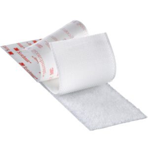 The partially unrolled white medical bandage reveals a visible adhesive side. The top layer displays red branding and text, while the underside has a textured, woven surface for wound care. Ideal as an accessory, its the 3M™ SJ3571 Scotchmate™ Fastener, measuring 1 x 150 - Loop White (1 Pack).