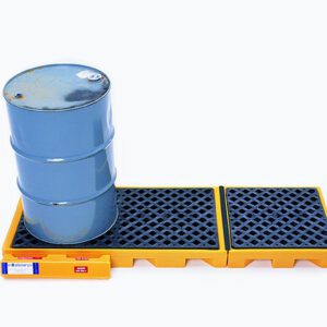 A slightly weathered blue metal drum sits on a yellow Vestil Ultra-Inline Spill Deck Three Drum, featuring a grid-like surface to capture leaks, all set against a plain white background.