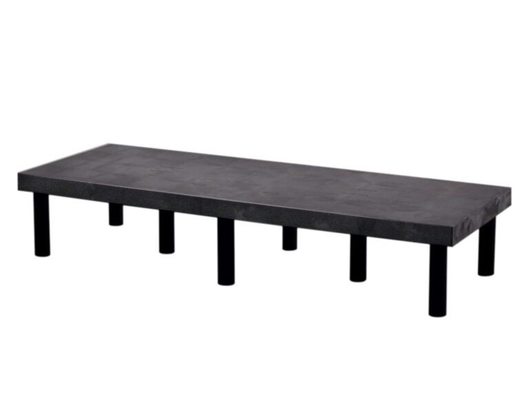 A minimalist black bench, inspired by the Vestil Dunnage Rack Solid Top - 66 X 24 design, features a concrete rectangular seat and six metal legs. Its modern style and strong build provide a smooth surface, ideal for contemporary spaces.