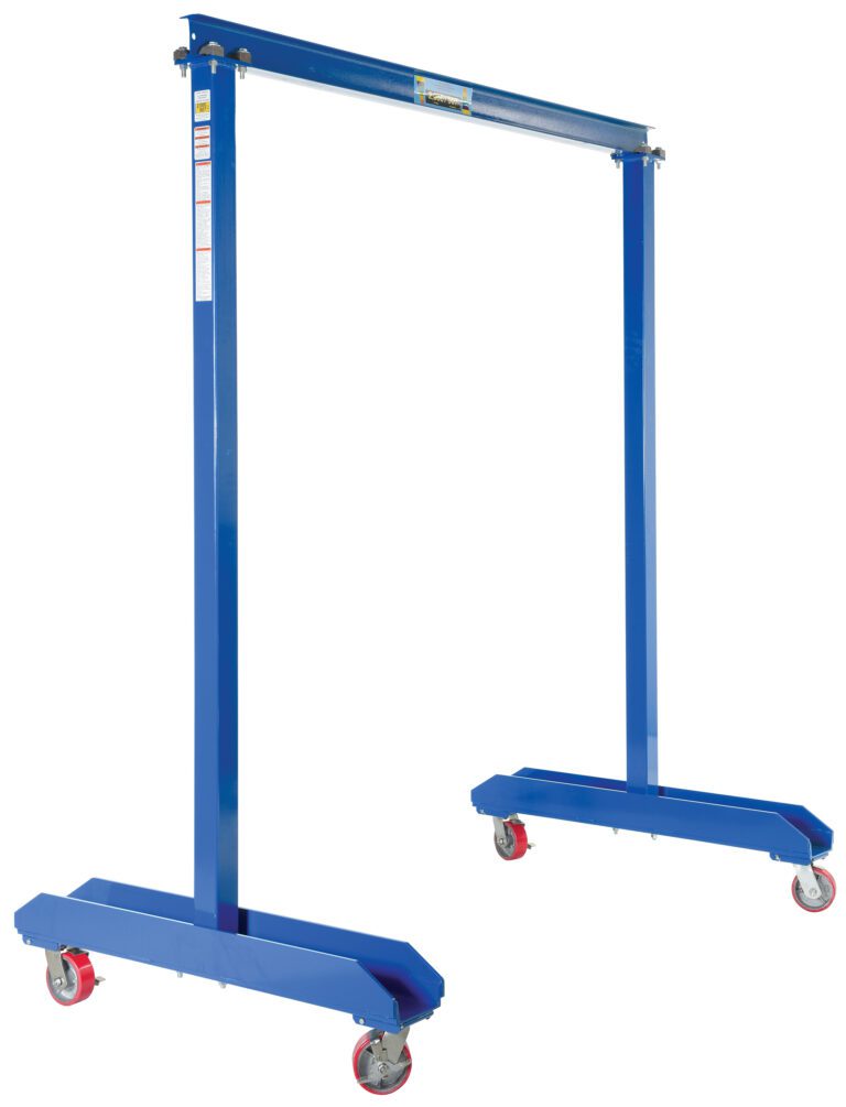 FPG-20_A.jpg Meet the Vestil Portable Work Area Gantry Crane 2K, a robust blue metal crane with a lightweight frame and four red caster wheels. Designed for lifting heavy loads, it features adjustable height and durable construction, ideal for industrial use.