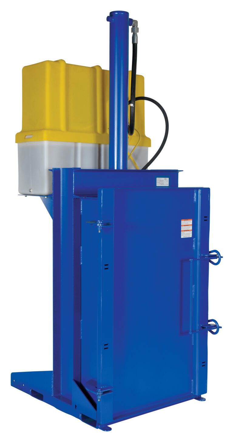 HDC-905-IDC-460V_A.jpg The blue industrial baler, resembling the Vestil Crusher/Compactor 460V, has a yellow and gray top, vertical hydraulic cylinder, rectangular chamber for compressing materials into bales, and various levers and connectors for efficient operation.