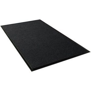 A rectangular black rubber mat with a textured surface and raised edges appears similar to the robust 3 x 20 Charcoal Waterhog™ Runner when viewed from an angle.