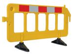 The Vestil Plastic Barrier, 23 x 79 x 40, shines in bright yellow with a gray/red reflective strip at the top. It stands on two black bases and has three open rectangular sections for improved visibility.
