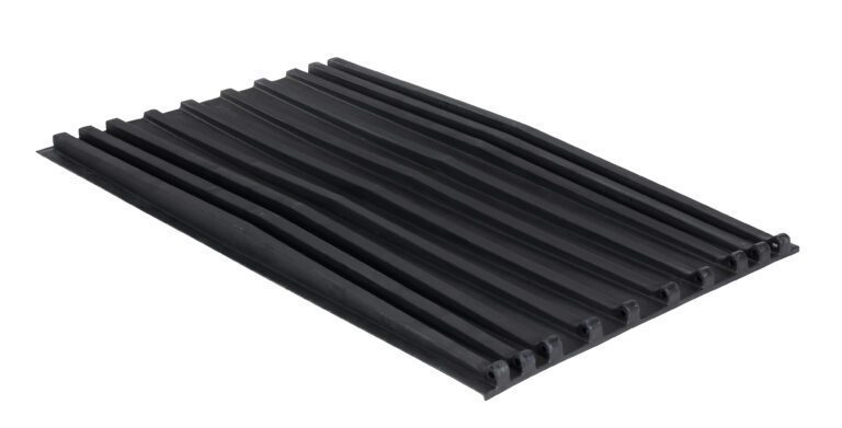 A black rectangular rubber mat with horizontal raised parallel ridges, similar in design to the Vestil Poly Lid For Size 1.5 Style D Hopper, has pointed edges and a slightly glossy surface.