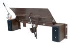 The image depicts the brown Vestil Hand Pump Edge-O-Dock Leveler 20K 66X29 with a lever mechanism, two black rubber bumpers on each side, and an elevated central platform showing its underside components.
