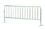 The Vestil Galvanized Barrier W/Flat Feet is a silver, metal crowd control barrier with vertical bars and stable flat feet, ideal for managing pedestrian traffic at large gatherings or events with its straightforward and functional design.
