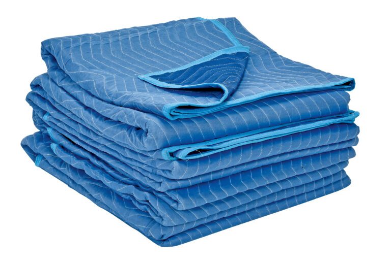 QPC-7280-UP-4PK_A.jpg The image shows a neatly folded stack of blue Vestil All Weather Moving 4 Pads against a white background. This 4-pack features light blue trim, is made from durable polyester, and has quilted texture for dependable protection during moves.
