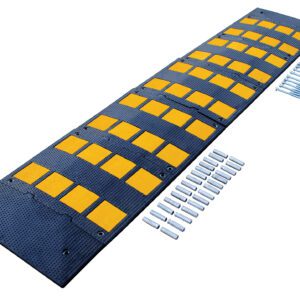 The Vestil Rubber Speed Hump 23.5 X 108 Concrete has a black surface with yellow reflective squares for visibility, a textured pattern for traction, and is secured to concrete with metal bolts and screws.