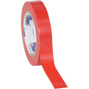 A partially unrolled roll of 1 x 36 yds. Red Tape Logic® Solid Vinyl Safety Tape displays its glossy finish, while the inner core bears a label with blue and red text and graphics on a simple white background.