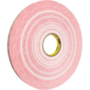 The 3M™ 920XL Adhesive Transfer Tape, measuring 1/2 x 1000 yds., features a pink peel-away layer that reveals a white adhesive. It is wrapped around a cardboard core and has a thin, lightweight design perfect for precision tasks.