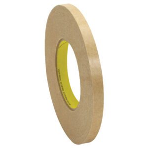A roll of brown masking tape with a yellow core stands upright against a white background, resembling the 1/2 x 120 yds. 3M™ 9498 Adhesive Transfer Tape Hand Rolls (72 Rolls/Case), yet exuding simplistic charm in its presentation.