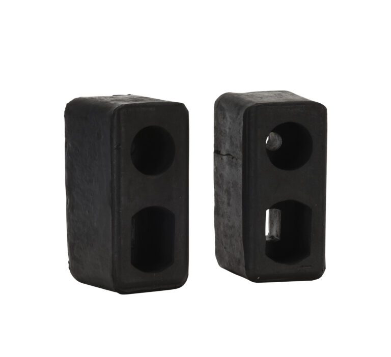 TB-10-2_A.jpg Two black Vestil Trailer/Crane Bumpers stand upright on a white background. Each rectangular rubber block features two vertically aligned holes, enhancing their minimalist and functional appearance.