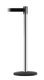 The Vestil Tensabarrier - Indoor stanchion post includes a black retractable belt on a round base, ideal for crowd control or queue management. The belt partially extends to the left, ensuring an organized flow of people indoors.