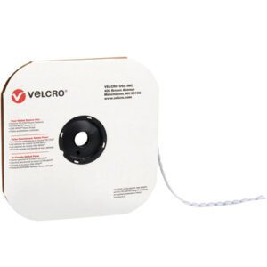 A partially unspooled white Velcro spool with a black center hub exposes the 1/2 White VELCRO® Brand Tape. The iconic red Velcro logo and contact details are on the side, indicating its ready for use.