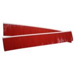 Two large red industrial brooms, similar to a Vestil Replacement Brush for the 60 VPS Pro Series, with long, thick bristles. Positioned diagonally on a white background, their invisible handles highlight the robust bristles.
