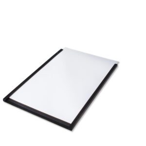 A blank white notepad with a black border is slightly angled on a white surface, binding on top. Next to it, an MH-USA Magnetic Label Holder (H.2.36 in. x W.7.87 in.) enhances organization with its sleek design, available in packs of 50.