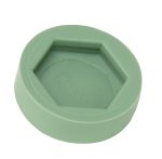 A green hexagonal Quantum Floor Glide with a raised center and 1 embossed on it, designed as non-marring floor protectors, is shown on a white background (4 per pack).